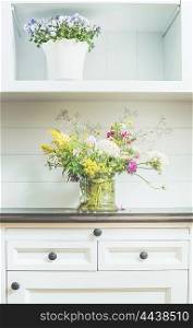 Flowers decoration on white dresser. Light floral Home decoration and interior
