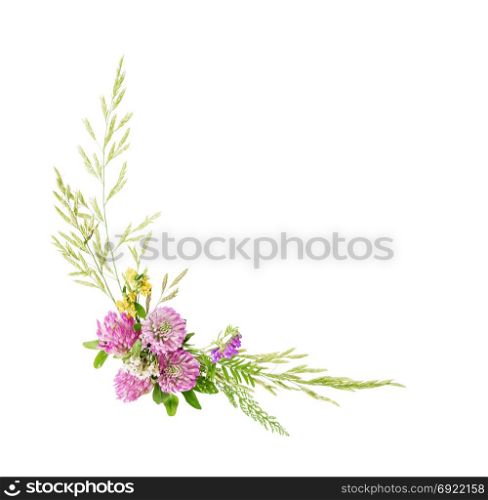 Flowers fram composed of wildflowers and grass, isolated on white background. Flat lay, top view