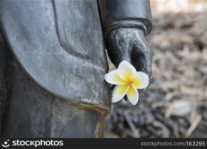 Flowers in hand statue