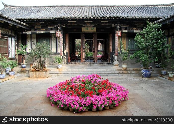Flowers in the inner ysrd of traditional chinese house, Chgina