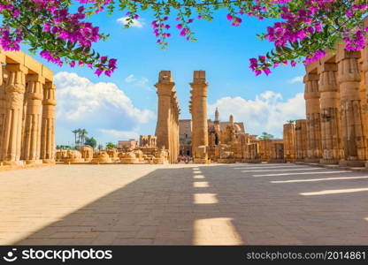 Flowers in the square with columns in Luxor temple, Egypt. Square in Luxor temple