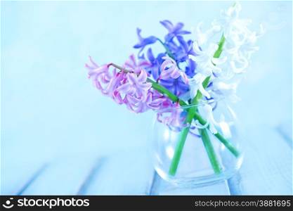 flowers in vase and on a table