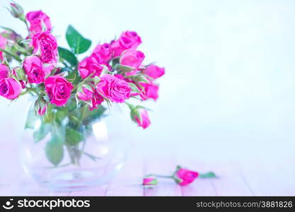 flowers in vase and on a table