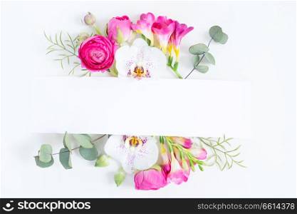 Flowers layout with copy space for cards, wedding invitation, posters, save the date or greeting design. Frame made of dried eucaliptus leaves and flowers on white background.. Flowers flat lay composition