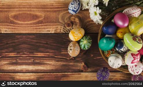 flowers near basket eggs