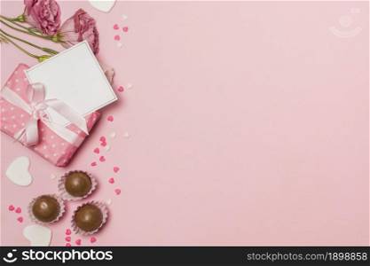 flowers near post card present box chocolate candies. Resolution and high quality beautiful photo. flowers near post card present box chocolate candies. High quality beautiful photo concept