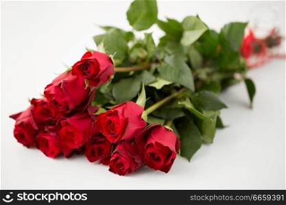 flowers, valentines day and holidays concept - close up of red roses bunch. close up of red roses bunch