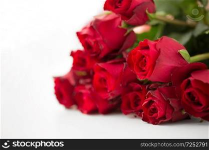 flowers, valentines day and holidays concept - close up of red roses bunch. close up of red roses bunch