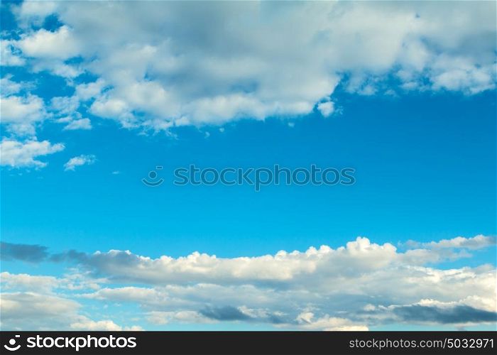 Fluffy clouds decorating a beautirful blue sky