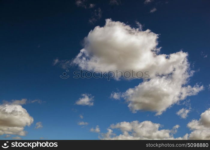 Fluffy clouds decorating a beautirful blue sky