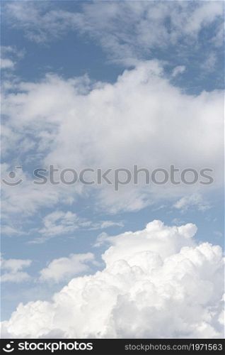 fluffy clouds sky vertical shot. High resolution photo. fluffy clouds sky vertical shot. High quality photo