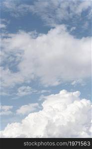 fluffy clouds sky vertical shot. High resolution photo. fluffy clouds sky vertical shot. High quality photo