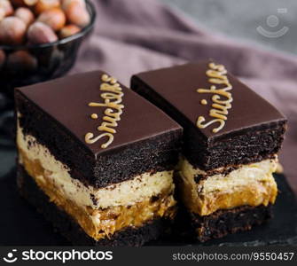 Fluffy snickers cake on stone board