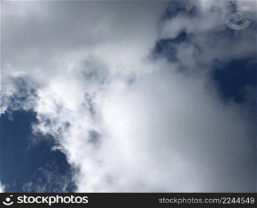 Fluffy white clouds and blue sky