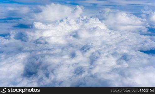 Fluffy White Clouds from Above. clouds and sky