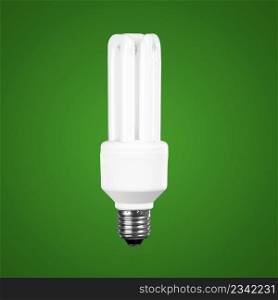 Fluorescent Light Bulb on a green background ? energy concept