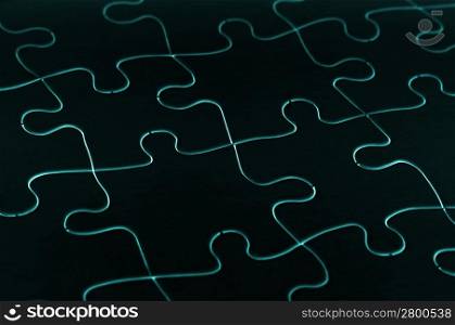 Fluro outlines of a jigsaw puzzle in black
