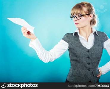 Fly fear metaphor, aerophobia concept. Business woman holding airplane in hand blue background