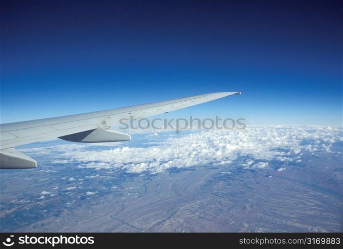 Flying Above The Clouds In A Commercial Jet