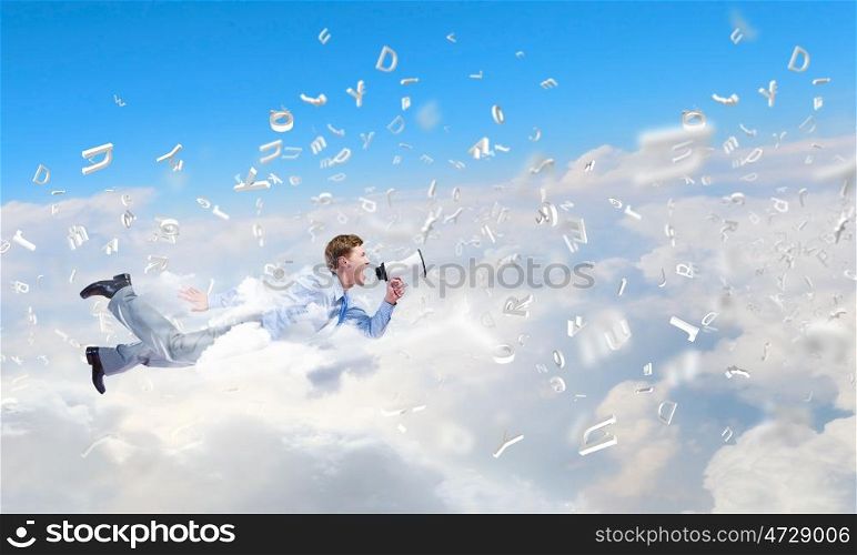 Flying businessman. Young man flying in sky and screaming in megaphone