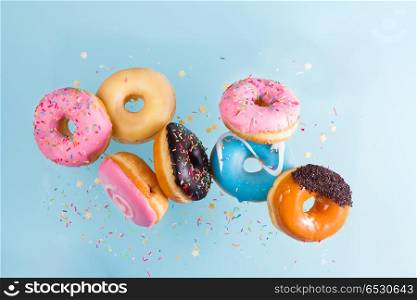 flying doughnuts on blue