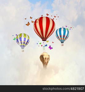 Flying elephant. Elephant flying in sky on colorful aerostat