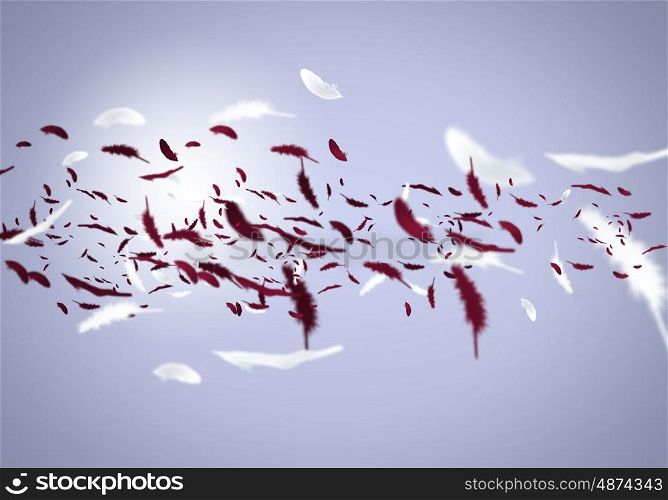 Flying feathers. Abstract background image of feathers flying in air