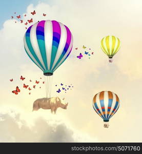 Flying giraffe. Sunny image of giraffe flying high in sky on aerostat