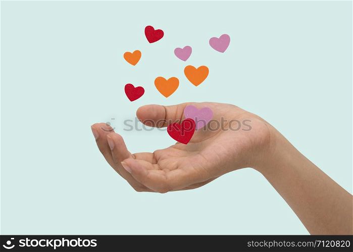 Flying hearts from hands, Valentine&rsquo;s Day, love concept, isolated blue background.
