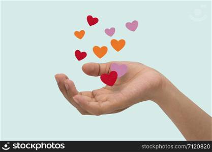 Flying hearts from hands, Valentine&rsquo;s Day, love concept, isolated blue background.