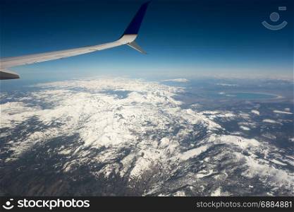 flying over california mountains in spring