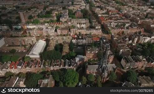 Flying over houses, Volden Church and Voldenpark in Amsterdam, Netherlands