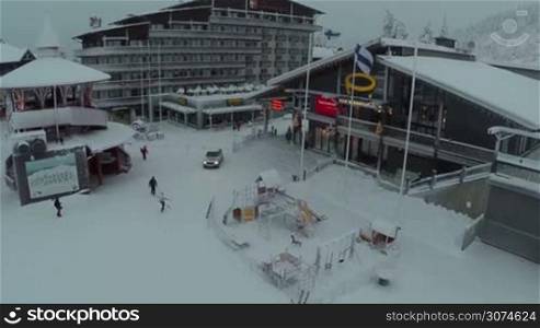 Flying over the hotel and restaurant with following view to the ski slopes in Ruka ski resort