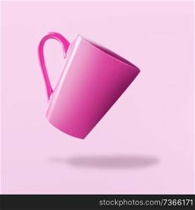 Flying pink empty cup at pink background