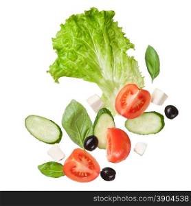 flying salad isolated in white - red tomatoes, pepper, cheese, basil, cucumber and olives