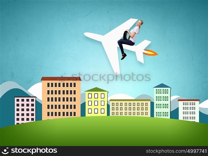 Flying the airplane. Young woman riding drawn airplane flying in air