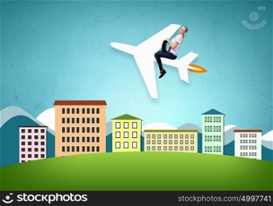 Flying the airplane. Young woman riding drawn airplane flying in air