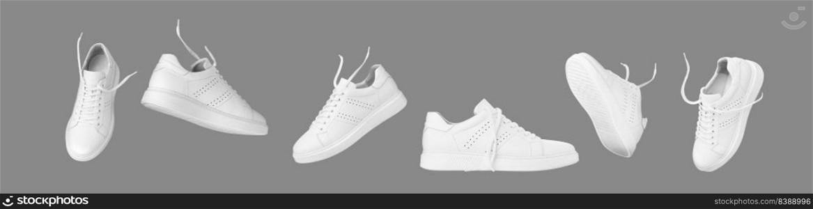 Flying white leather sneakers isolated on gray background. Fashionable stylish sports casual shoes. Creative minimalistic layout with footwear. Advertising for shoe store, blog