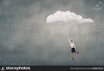 Flying woman. Young determined businesswoman flying high in sky on cloud