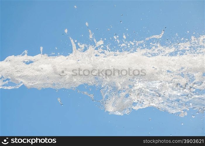 foaming water splash against a blue background