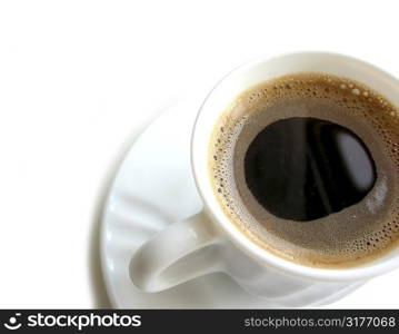 Foamy espresso coffee in a white cup with saucer on white background, space for text