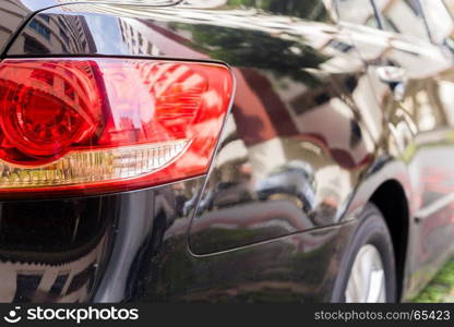 Focus closeup of Car rear light, Detail of modern car rear lamp black color