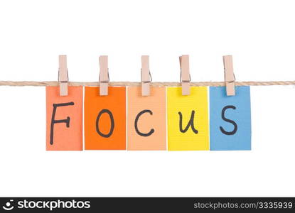 Focus, Colorful words hang on rope by wooden peg