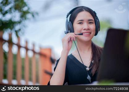 Focus microphone Asian women working from home call center service consult support,Business Work new normal