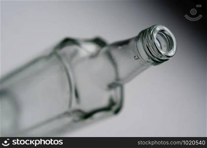 Focus on a bottle neck. The rest of the bottle is blurred.