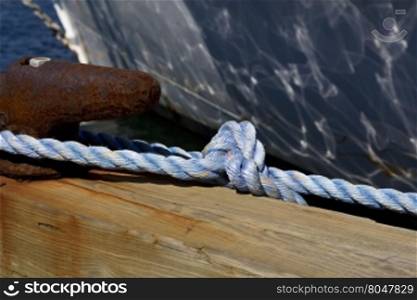 Focus on nautical rope tied to cleat in Newport Marina, Rhode Island, USA.