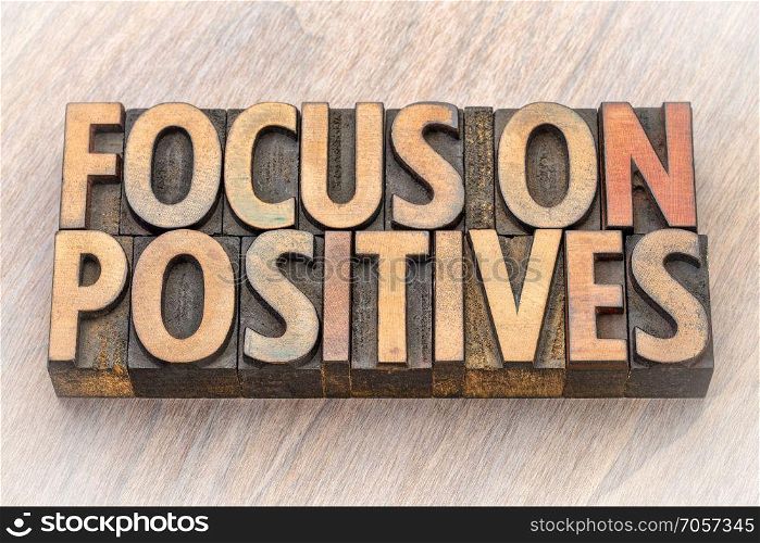 focus on positives - word abstract in wood type. focus on positives - word abstract in vintage lettepress wood type printing blocks