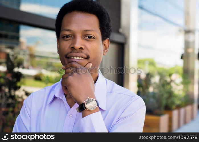 Focused Afro American businessman thinking in the city. Success in business