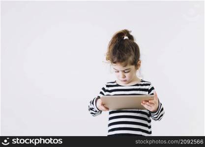focused girl using tablet