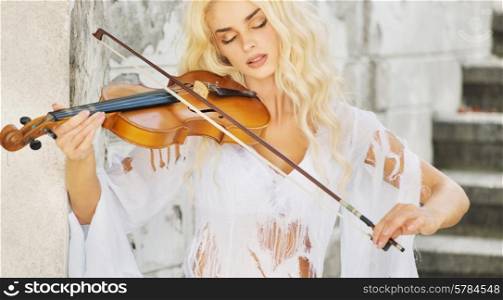 Focused lady playing the violin